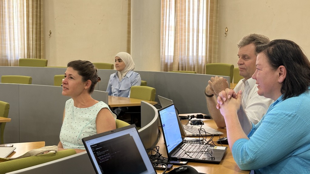 BIP participants working on laptops during a hands-on AI workshop session at the University of Málaga