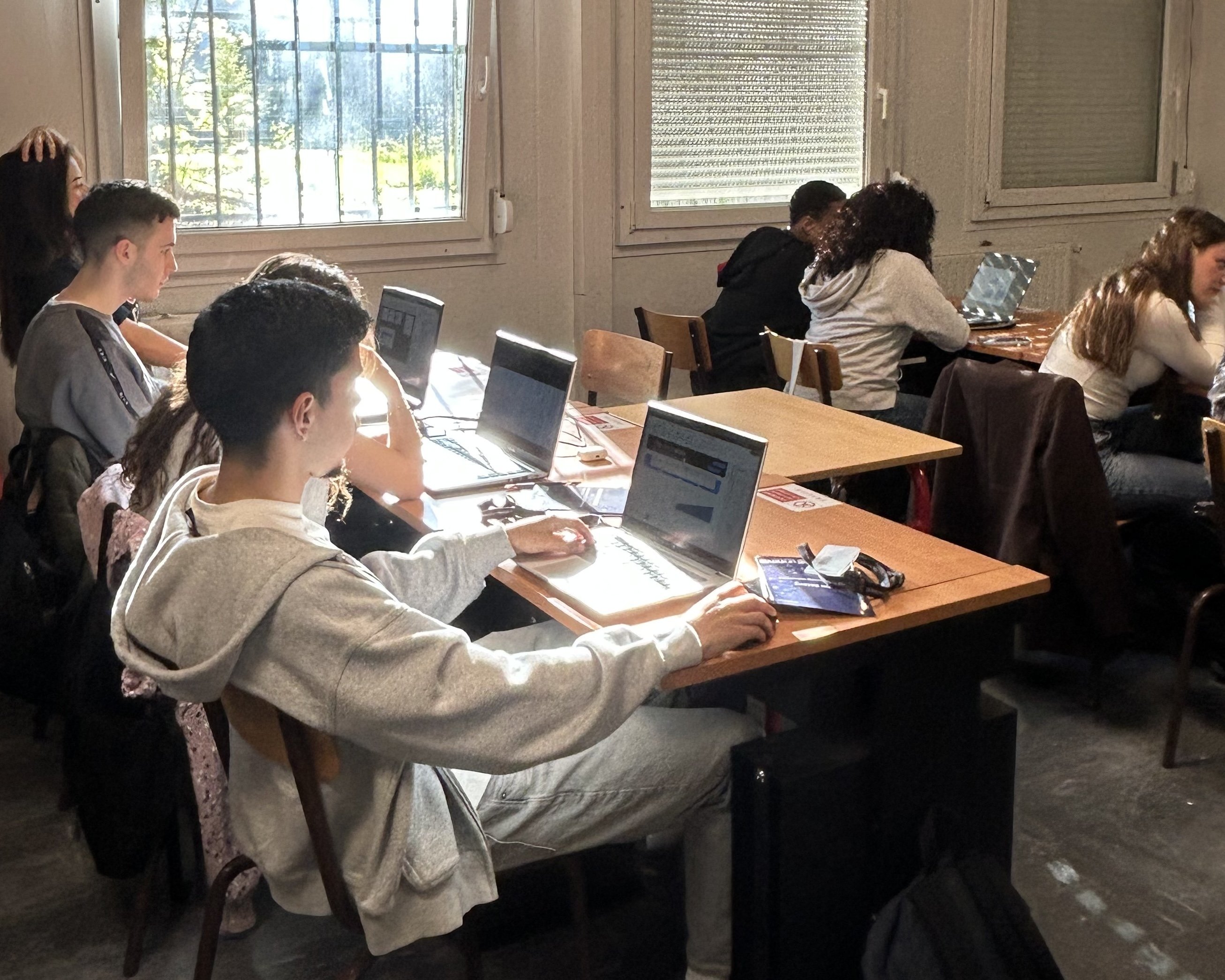 Hackathon participants developing Business Intelligence dashboards in small international groups