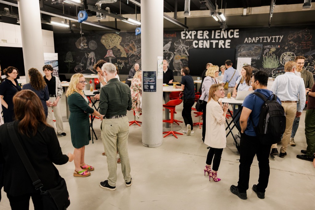 Workshop participants networking between sessions at the THUAS Experience Centre