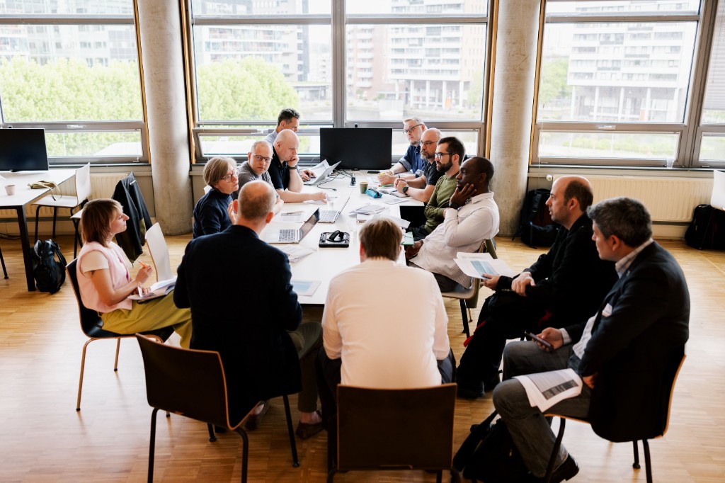 Participants in a structured working session at the AI & Robotics workshop